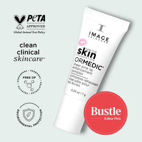 IMAGE Skincare product beside a coin showing 0.25 fl oz scale for travel convenience
