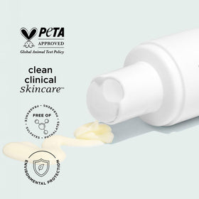 IMAGE Skincare bottle next to hand for scale communicating product size and travel convenience