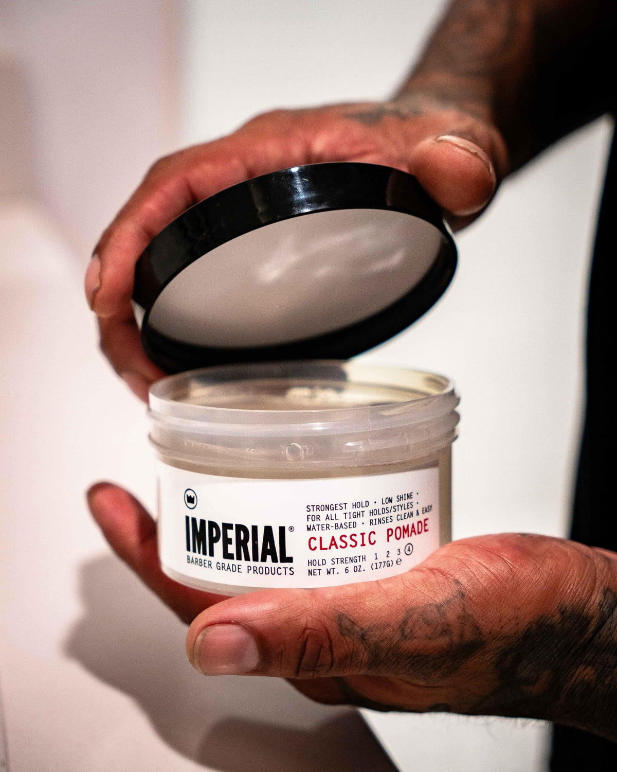 Imperial Barber Grade classic pomade styled hair with comb, precise shaping and control