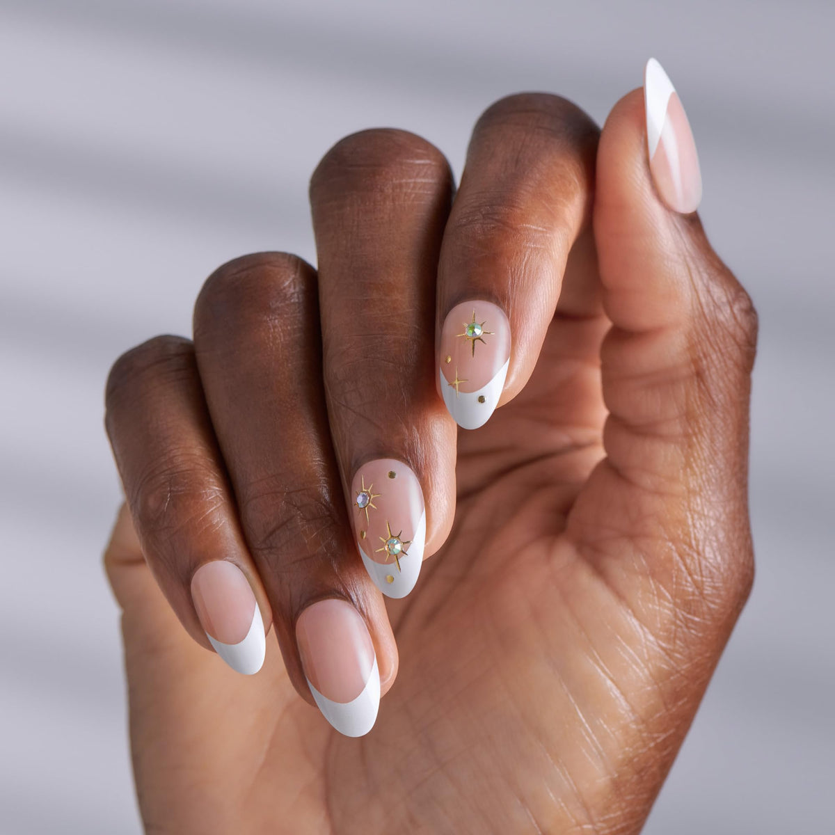 imPRESS close-up of almond-shaped white nail tips highlighting smooth finish and fit