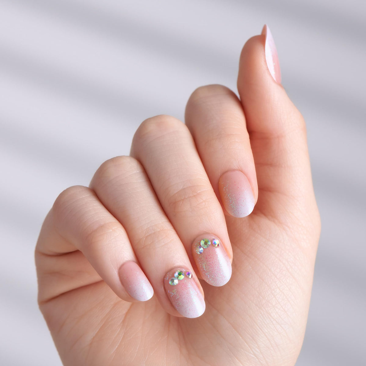 imPRESS close-up of nail oval shape and smooth pink finish benefit