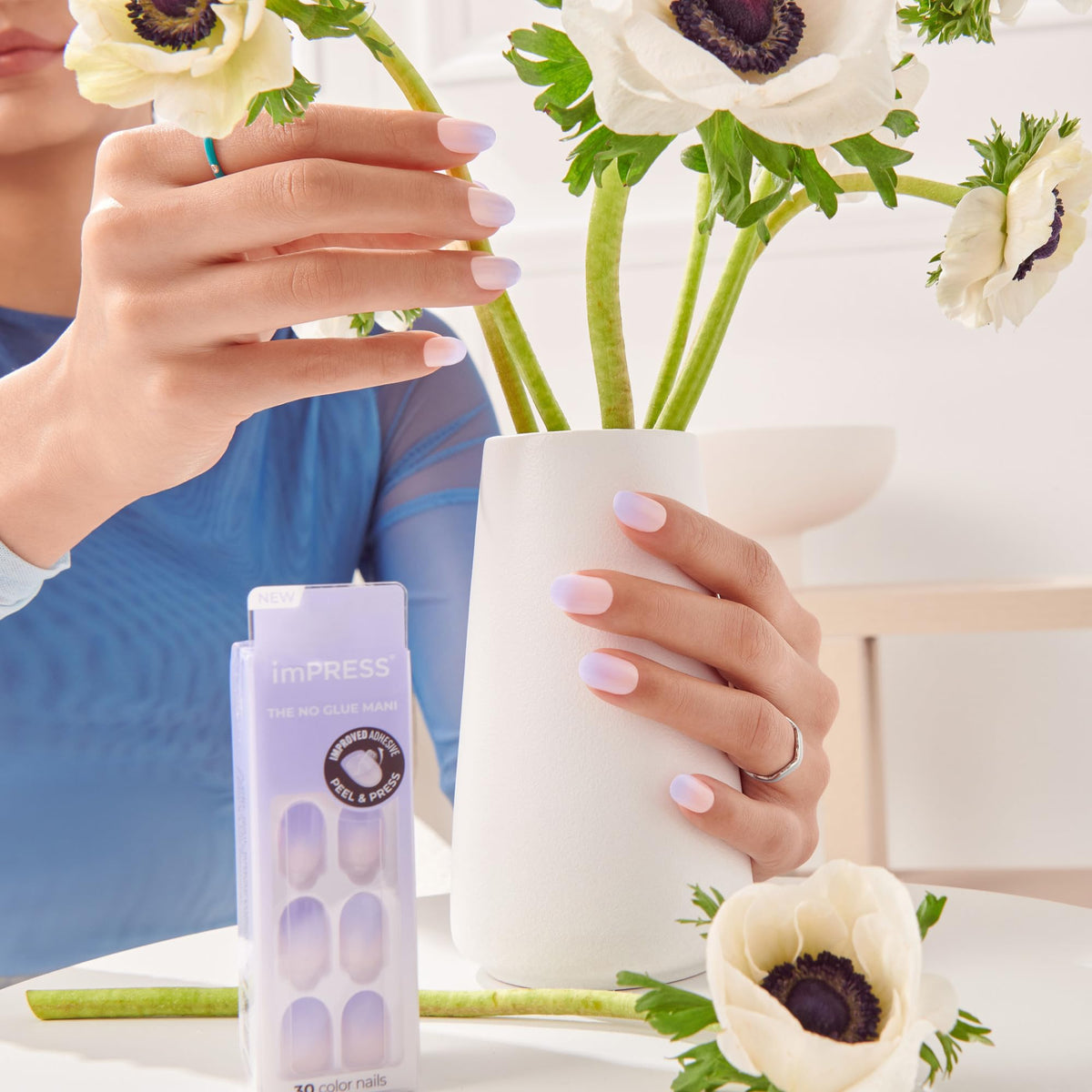 imPRESS side profile of a short oval press-on nail demonstrating low-profile fit and comfort
