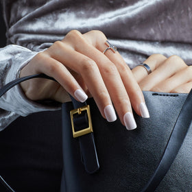 imPRESS Kiss worn on model hands showing high-gloss pearlescent benefit