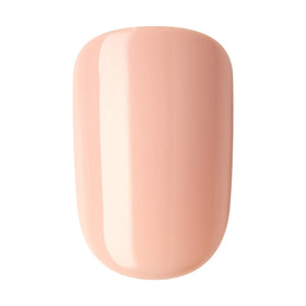 imPRESS lifestyle shot on desk showing a subtle nude manicure for versatile styling