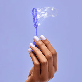 imPRESS nails in hand illustrating short length and natural-feel scale advantage