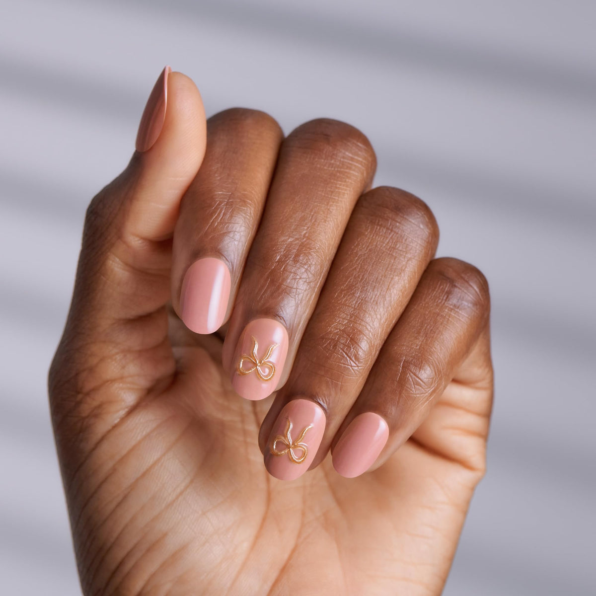 imPRESS close-up of a single short oval nail showing smooth finish and precise shape