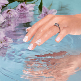 imPRESS nails beside a coin for clear size and short square scale