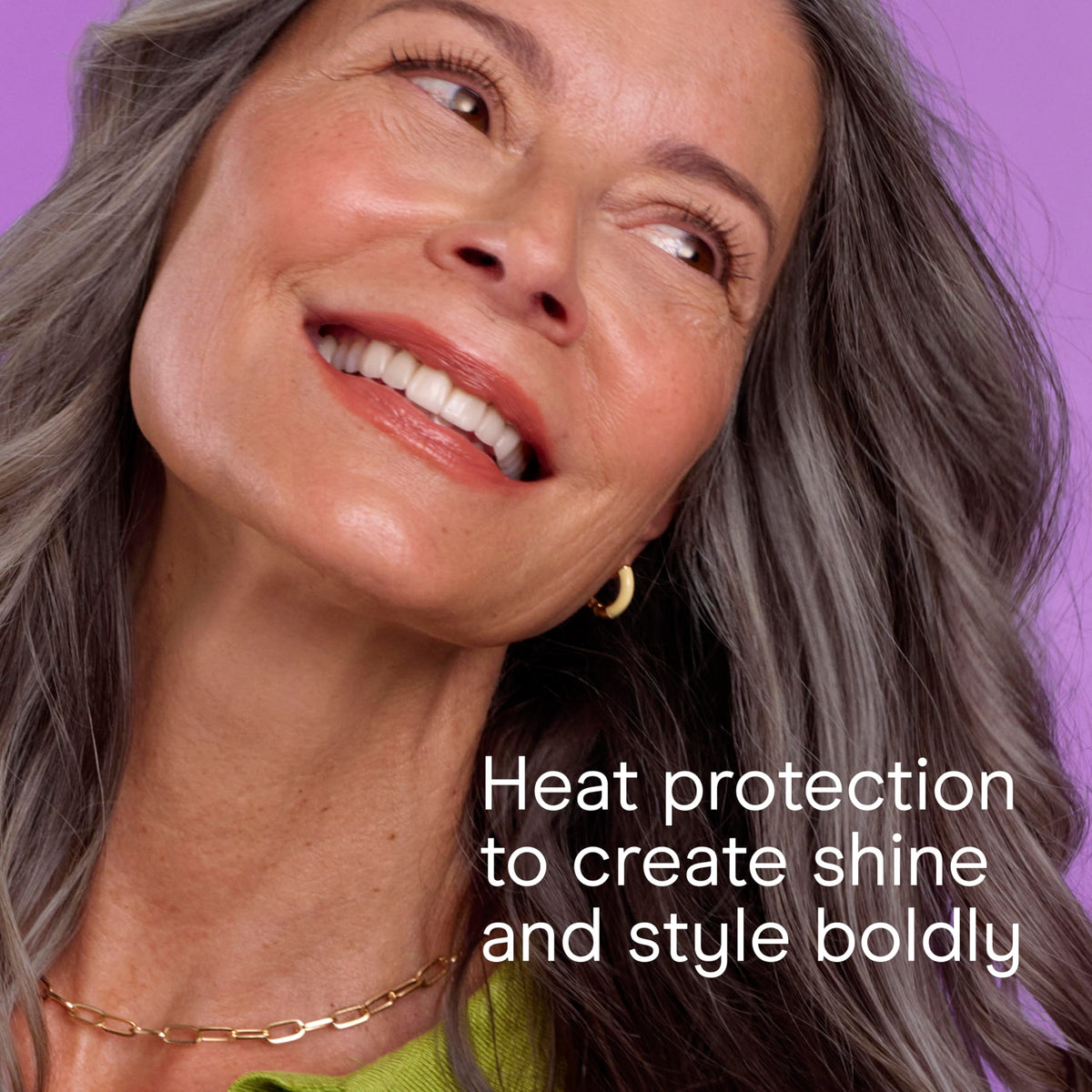 INFINITIPRO BY CONAIR curling iron shown next to hand to show compact travel-ready size benefit