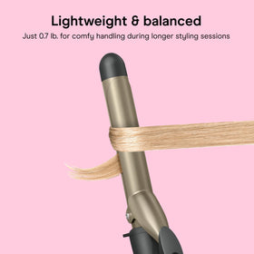 INFINITIPRO BY CONAIR curling iron in use on long hair for classic curls