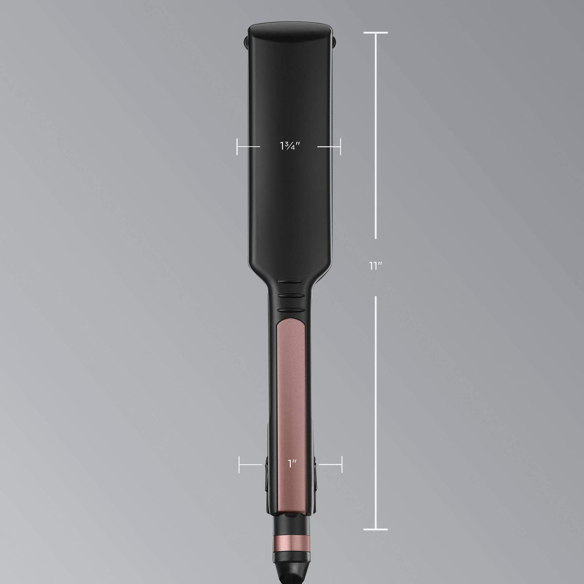 INFINITIPRO by Conair held in hand to show size and professional 1 3/4-inch plate scale
