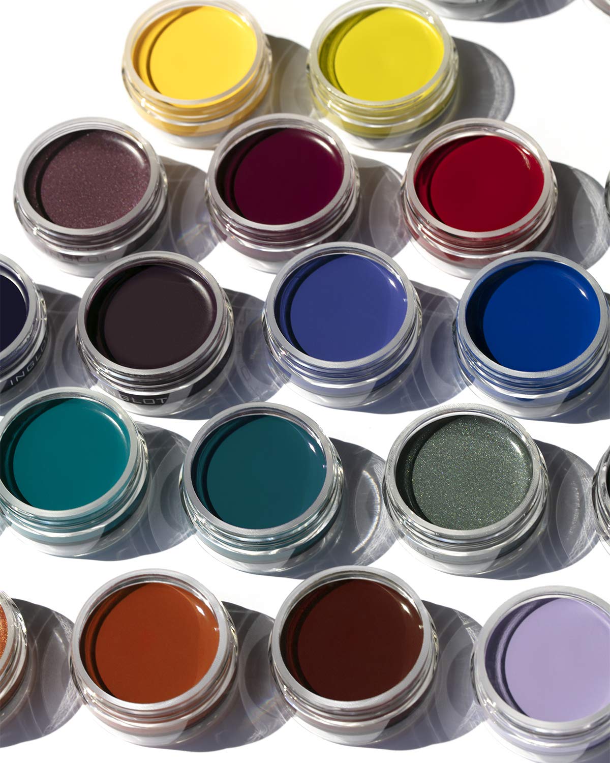 Inglot jar on a vanity next to brushes and cosmetics illustrating professional-ready application benefit
