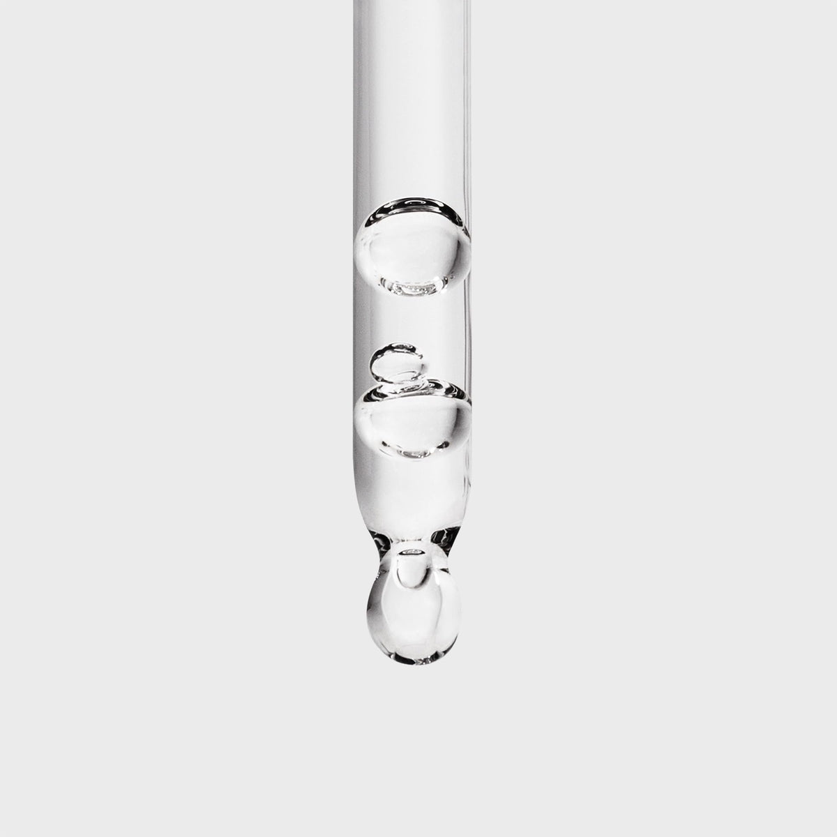Inglot Duraline dropper detail releasing a clear drop for hygienic controlled application