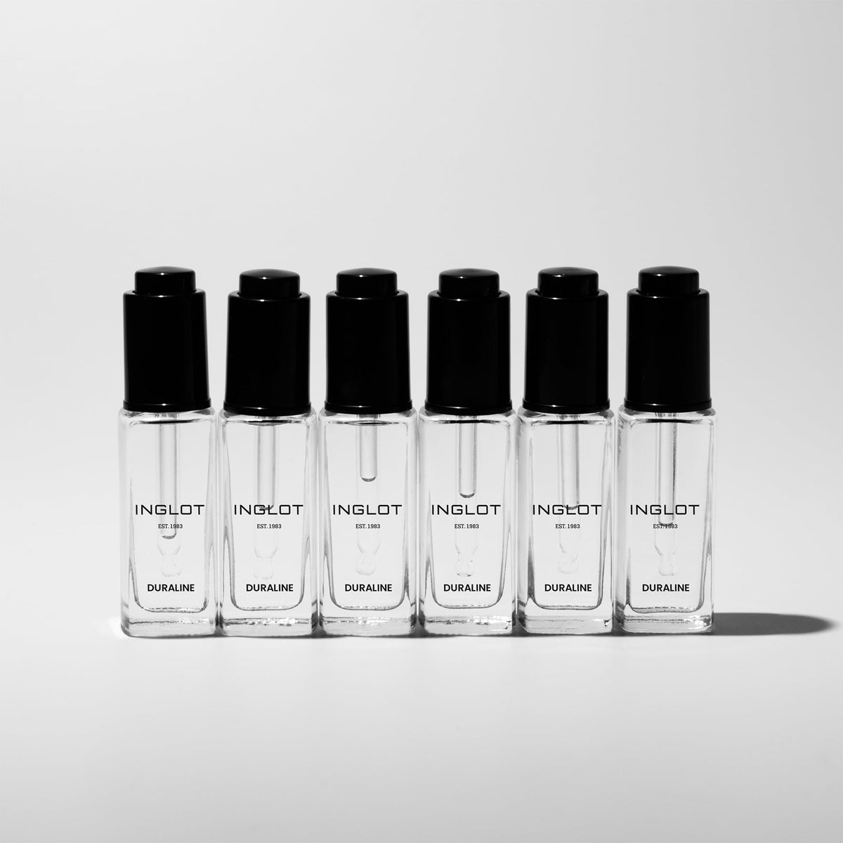 Inglot Duraline held in hand to show 9 ml scale and travel-friendly professional size