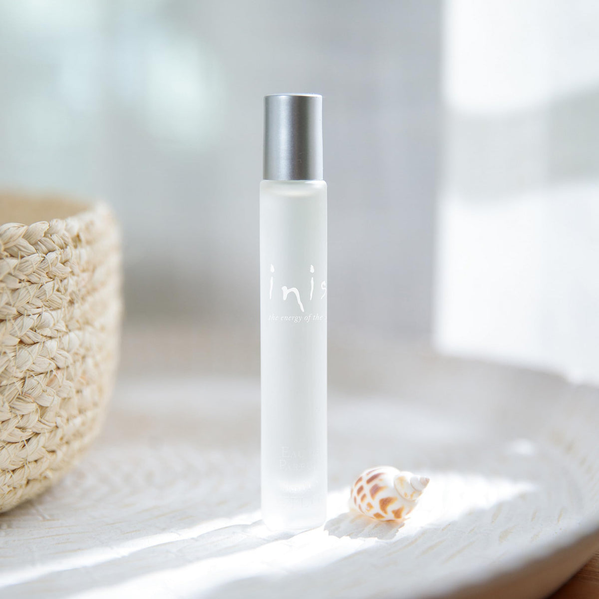 Close-up of Inis frosted pebble bottle texture highlighting elegant finish