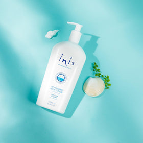 Inis bottle staged in bathroom setting conveying daily ritual and freshness