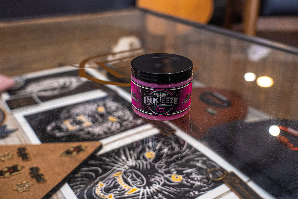 INK-EEZE jars arranged with ingredient visuals highlighting plant-based oils and waxes