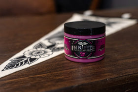 INK-EEZE held in hand to show 6oz scale for portability and value