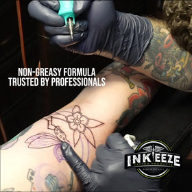 INK-EEZE next to a hand for size comparison highlighting travel-ready tube