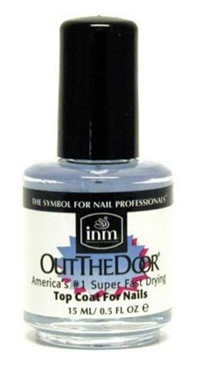 INM Out The Door front bottle shot showing compact packaging and quick-dry benefit