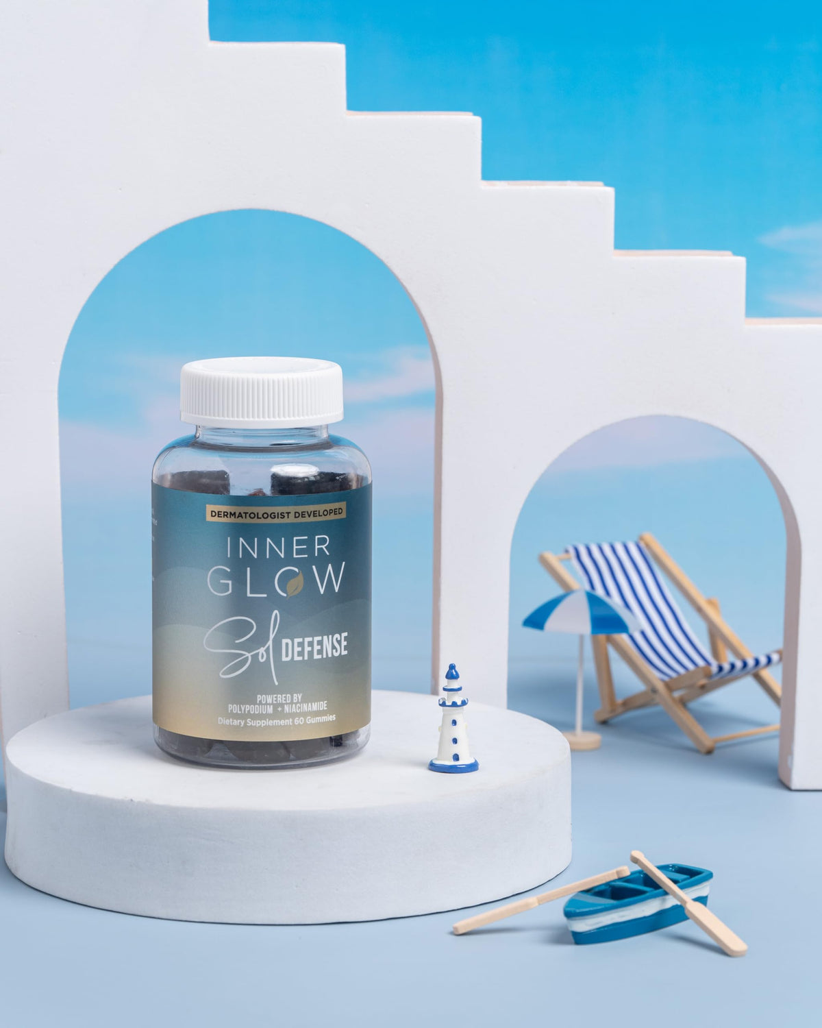 Inner Glow bottle on a beach towel showing travel-friendly sun care support