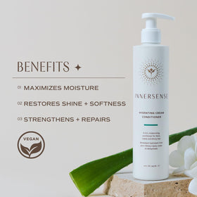 INNERSENSE applying conditioner to mid-lengths with hands, demonstrates easier detangling benefit