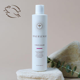 INNERSENSE applying volumizing lotion to damp hair creating root lift and improved manageability