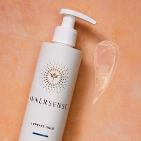 INNERSENSE stylist applying gel in salon showing professional-level curl control benefit