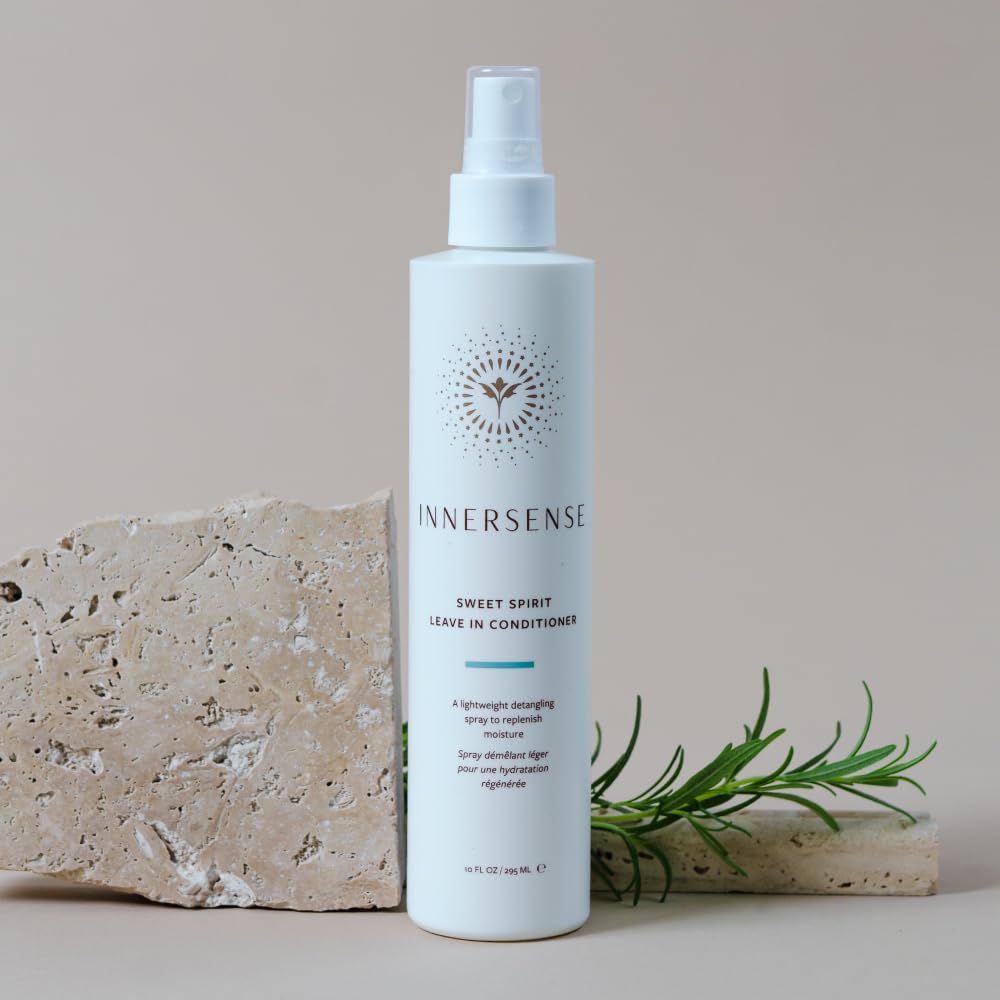 INNERSENSE bottle held in hand showing 10 fl oz scale and travel-friendly size