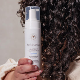 INNERSENSE size comparison in hand to show 6 fl oz travel-friendly volume