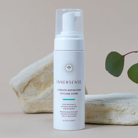 INNERSENSE product next to a hand for scale and travel convenience