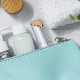 innobeaut held in hand to show size and travel-friendly convenience