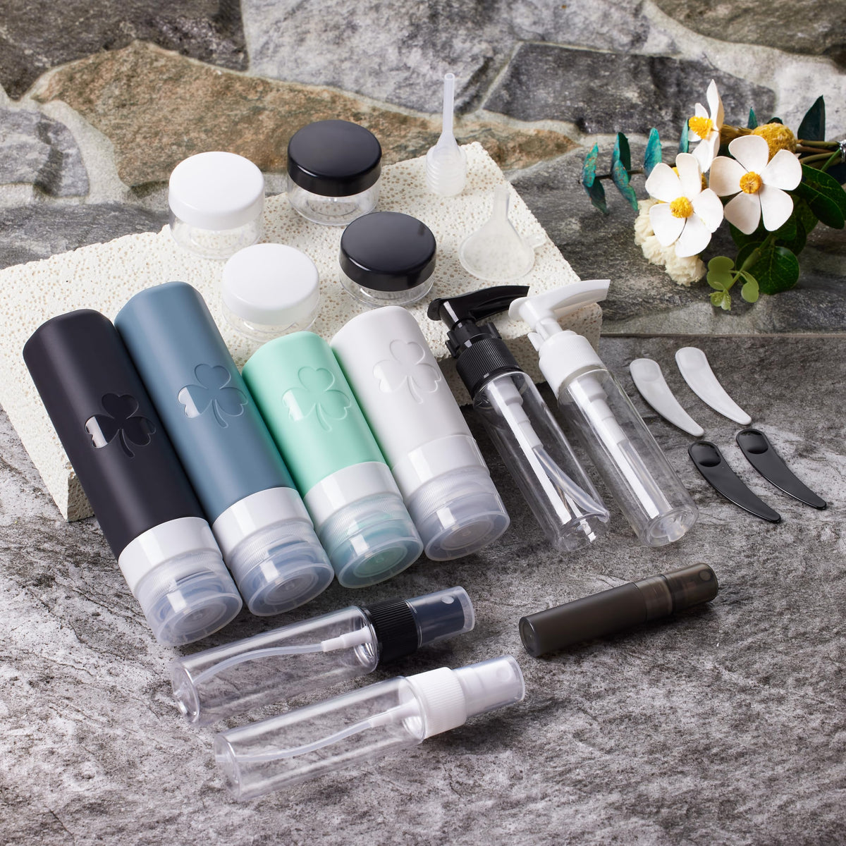 INSFIT bottles held in hand for scale, illustrating compact travel size and lightweight portability