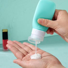 INSFIT bottle being squeezed to dispense shampoo neatly