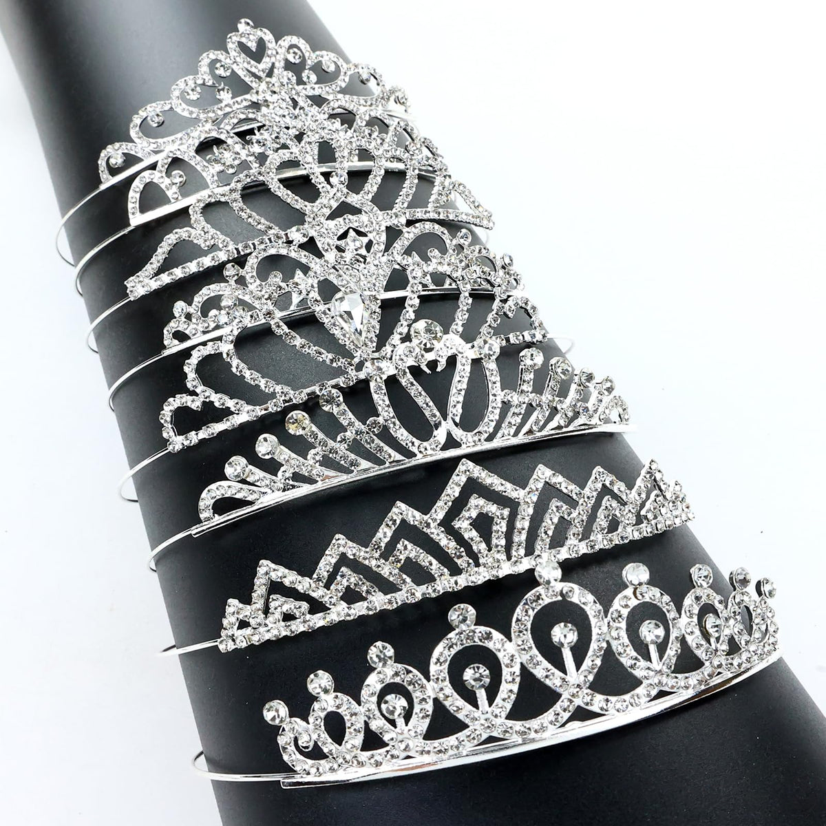 inSowni tiara beside ruler and hand showing size and fit guidance