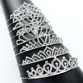 inSowni tiara beside ruler and hand showing size and fit guidance