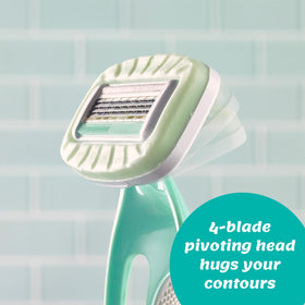 INTUITION razor held in hand showing size and travel-friendly scale