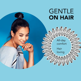 invisibobble next to ruler showing compact size and travel-friendly portability