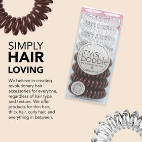 invisibobble next to coin to show compact size and portability