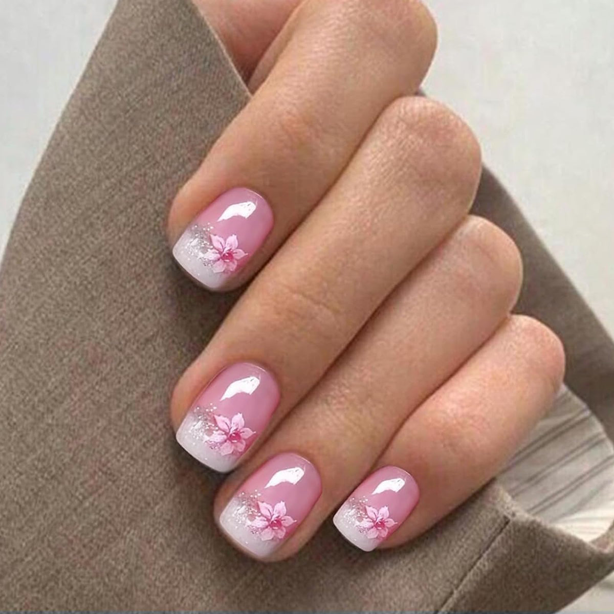IQXGE strips applied on nails in-hand, demonstrating neat immediate result