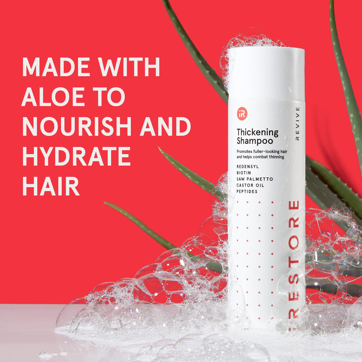 iRestore shampoo in hands use illustrating lather and nourishment