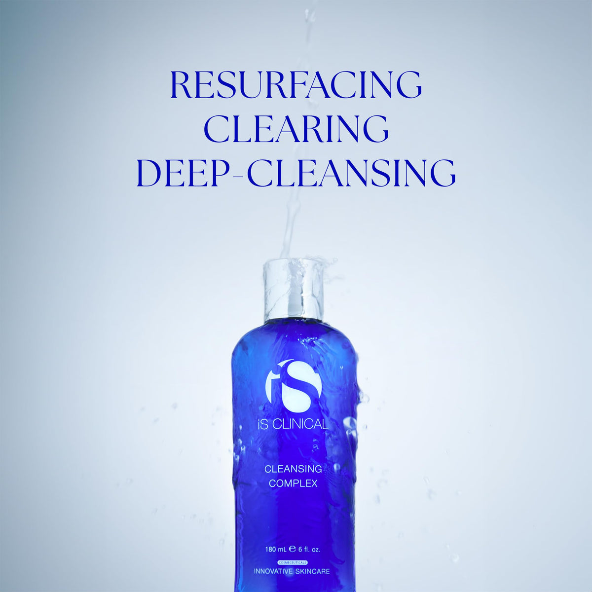 iS CLINICAL cleanser in hand being massaged onto skin for makeup removal benefit