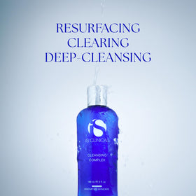 iS CLINICAL cleanser in hand being massaged onto skin for makeup removal benefit