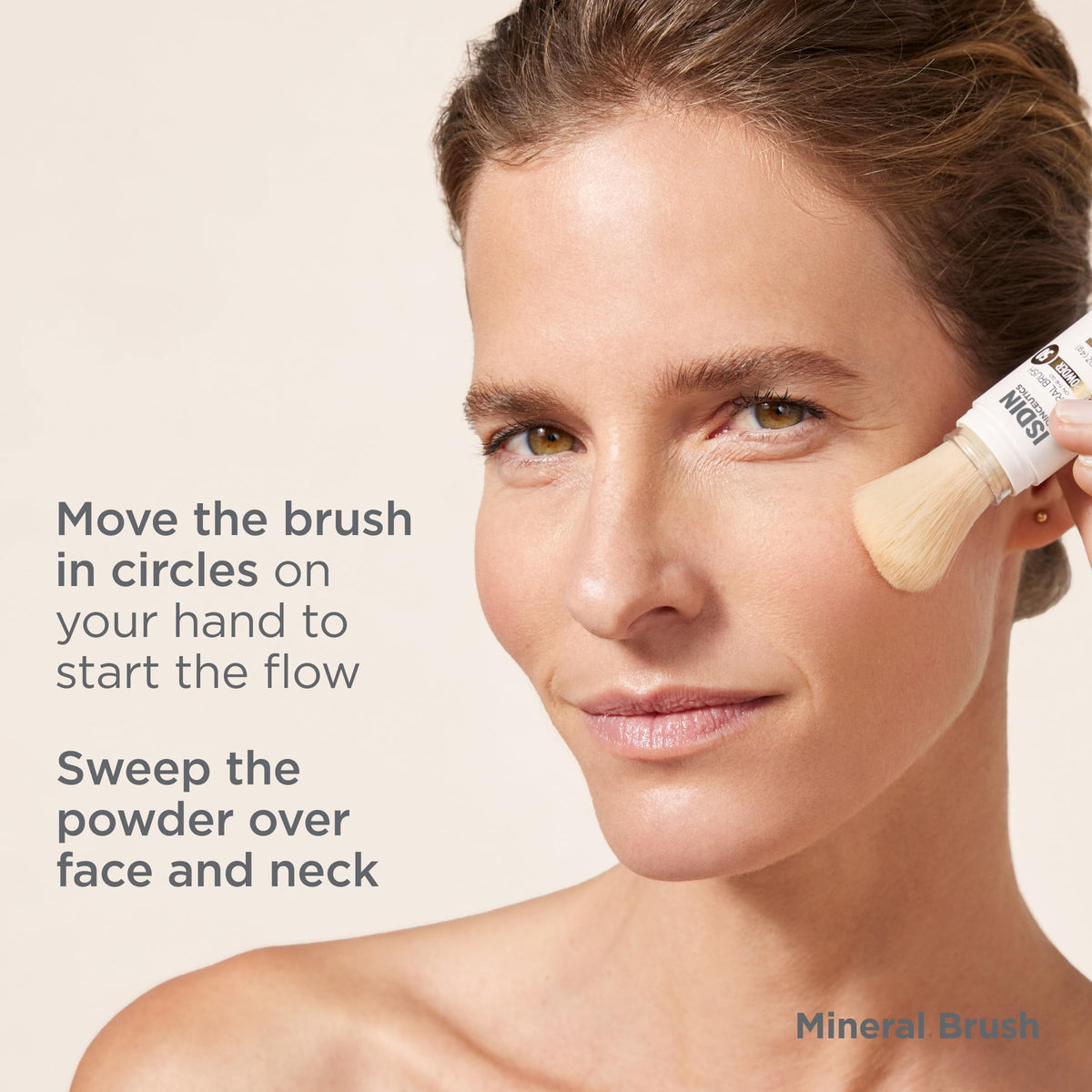 ISDIN brush placed with makeup items showing compatibility benefit