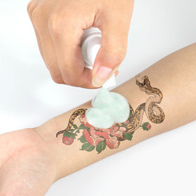 iseheri cleaning tattoo process in use with artist applying foam to maintain clear working area