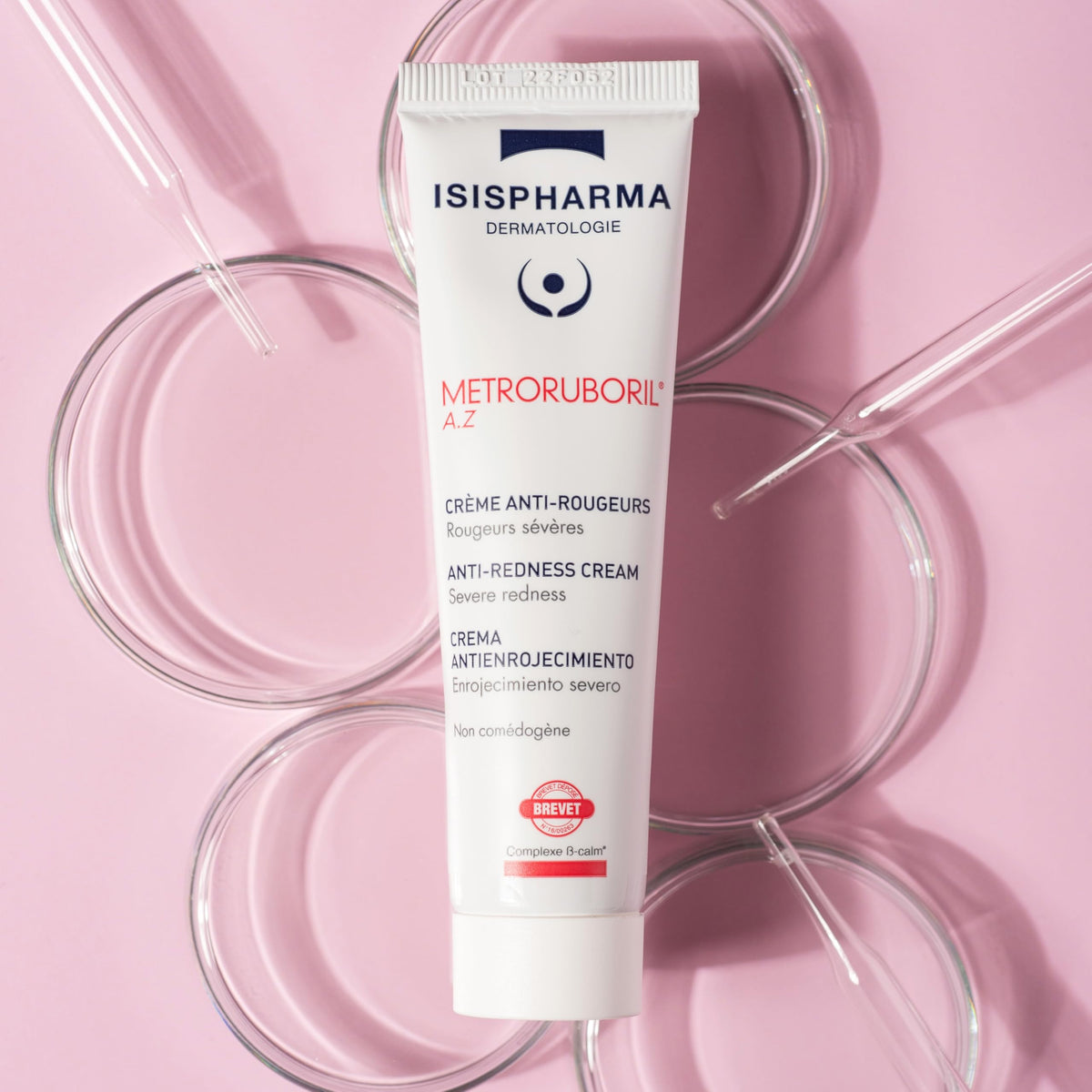 IsisPharma cream texture on fingertip demonstrating lightweight absorbency