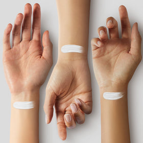 IS'MINE white foundation swatches on arm showing full opacity and buildable coverage