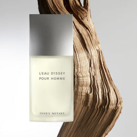 Issey Miyake bottle next to ruler showing 2.5 oz size and travel convenience
