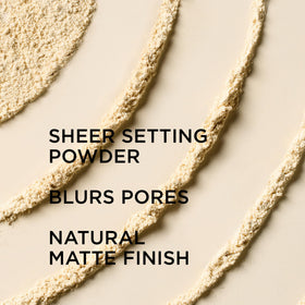 IT Cosmetics powder being applied with brush for pore-blurring benefit
