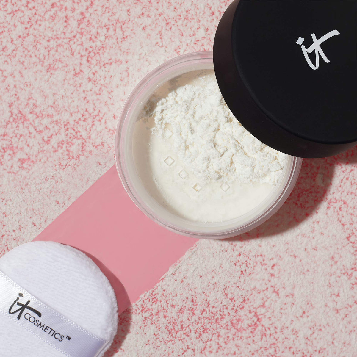 IT Cosmetics powder on vanity with tools highlighting everyday use and polished results