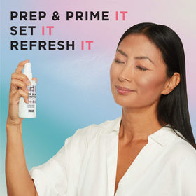 Person using IT Cosmetics setting spray outdoors to refresh makeup and hydrate